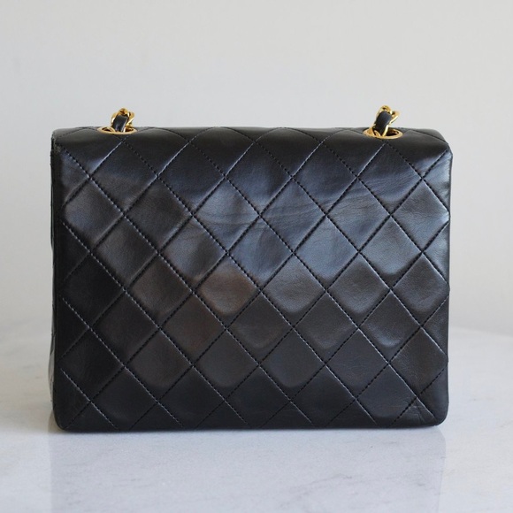 Vintage Chanel / Black Lambskin
20cm Square with 24k Gold
Hardware - Picture 3 of 14